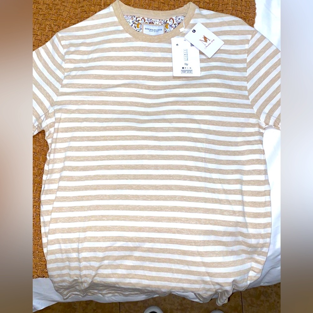 Selling my brand new Denim and flower T-Shirt, tags are still on it! Very nice